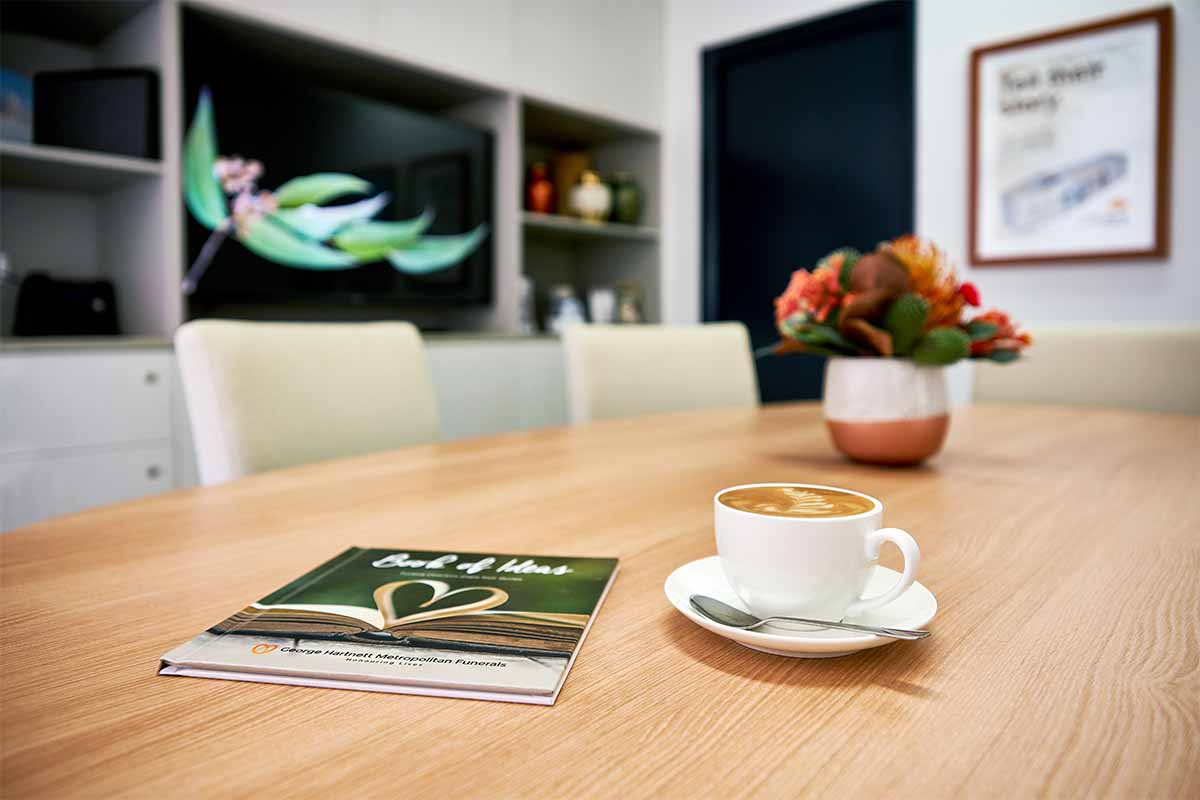 GHM Funerals Albany Creek Book of Ideas on an arrangement room table